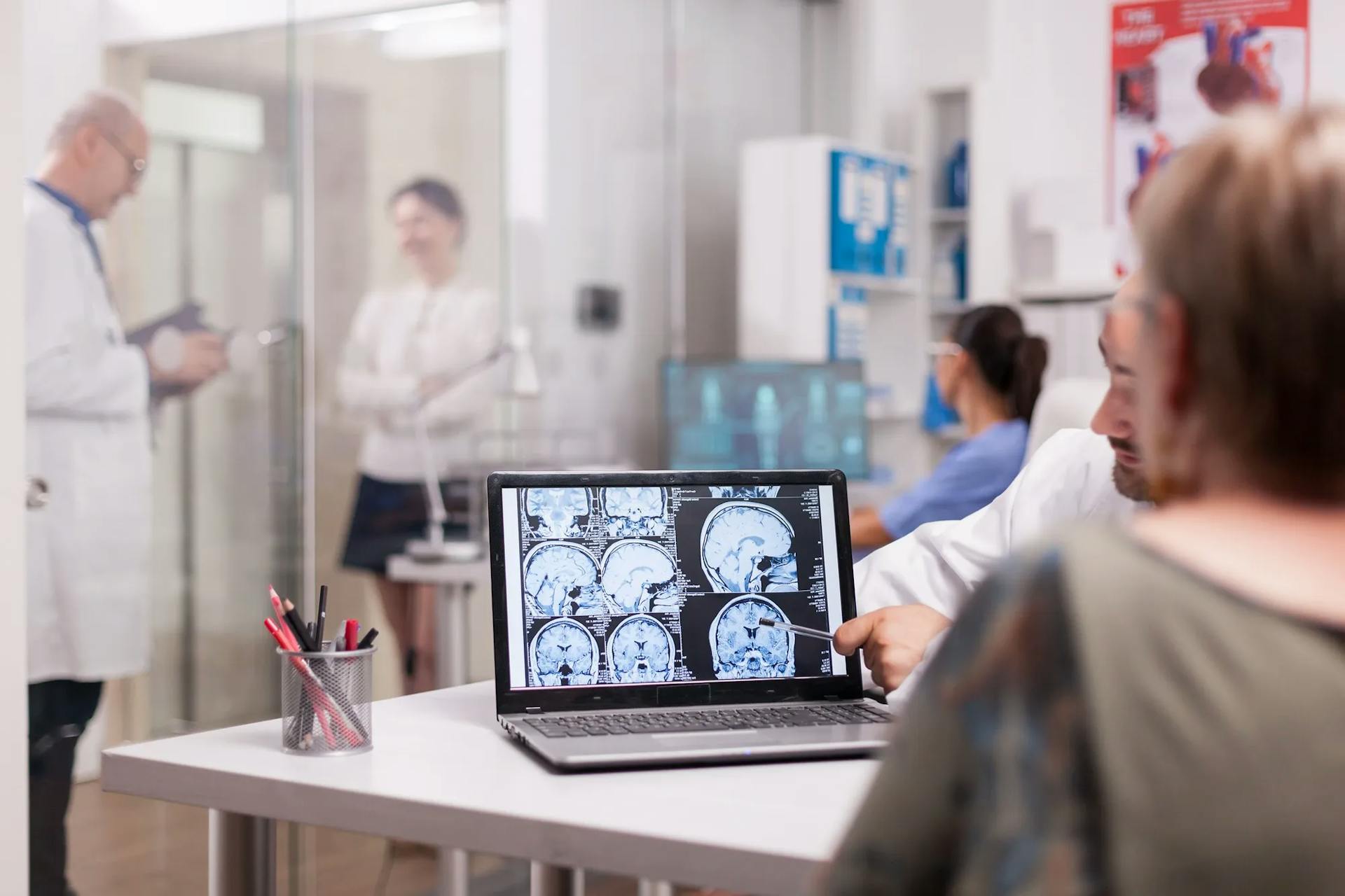 https://strapiassetsprod.s3.amazonaws.com/senior_woman_hospital_office_looking_brain_ct_scan_while_discussing_with_doctor_about_diagnosis_sick_young_woman_elderly_medic_with_grey_hair_clinic_corridor_ef9fc6258b.webp